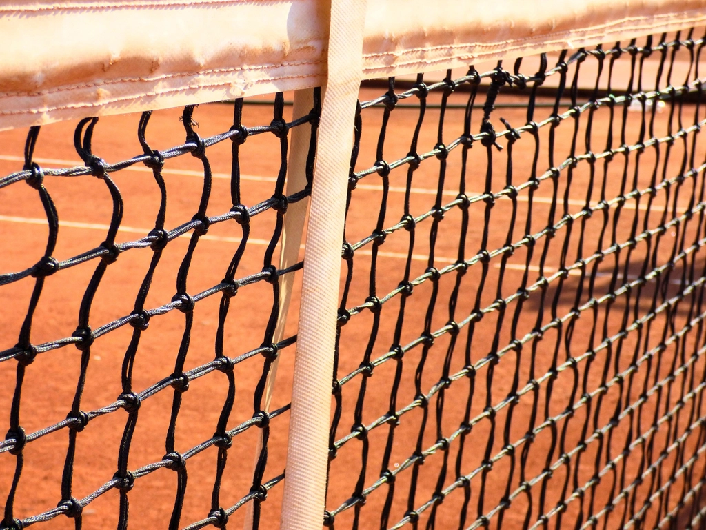 Close-up of a tennis net on a court